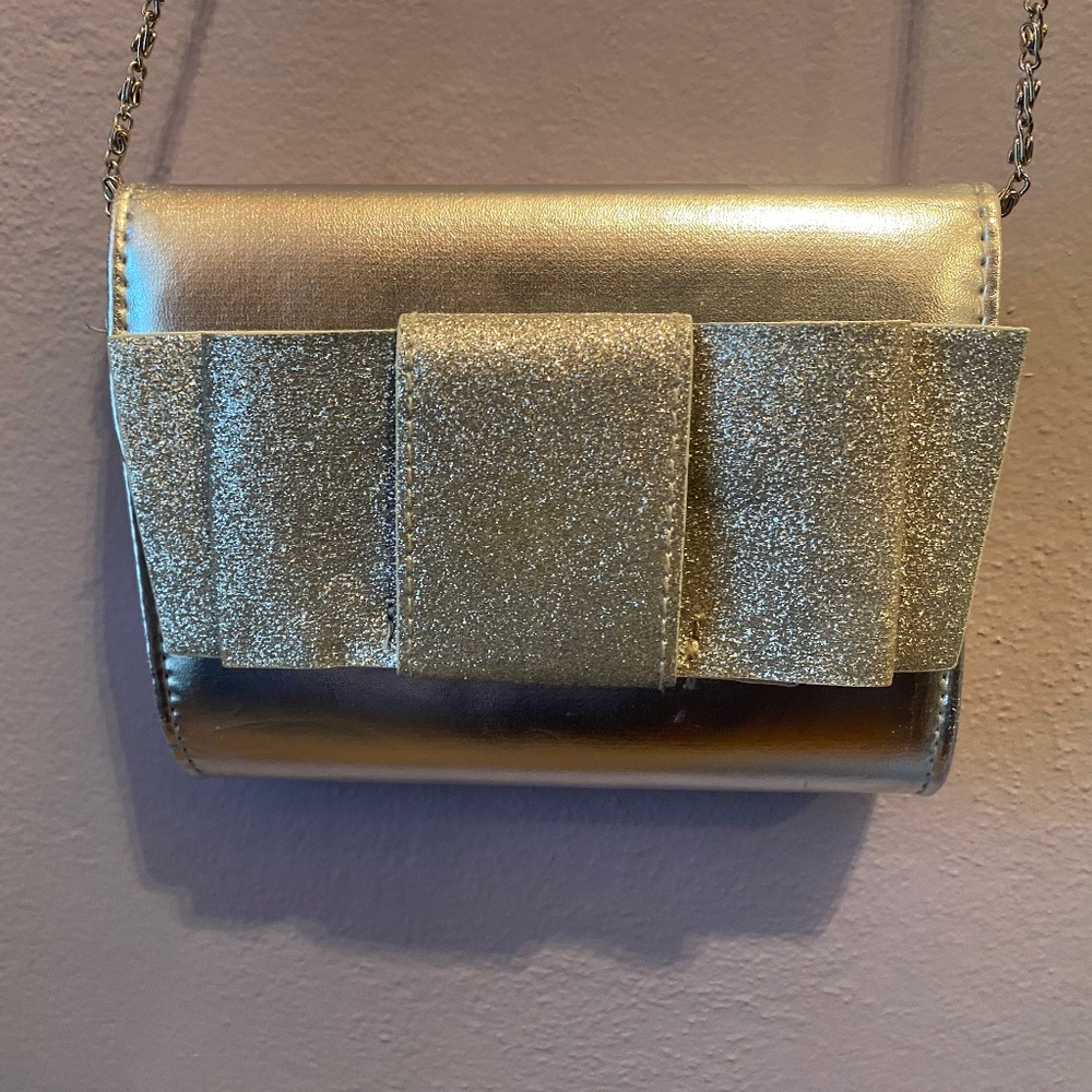 Metallic silver clutch with chain strap - glitter bow detail